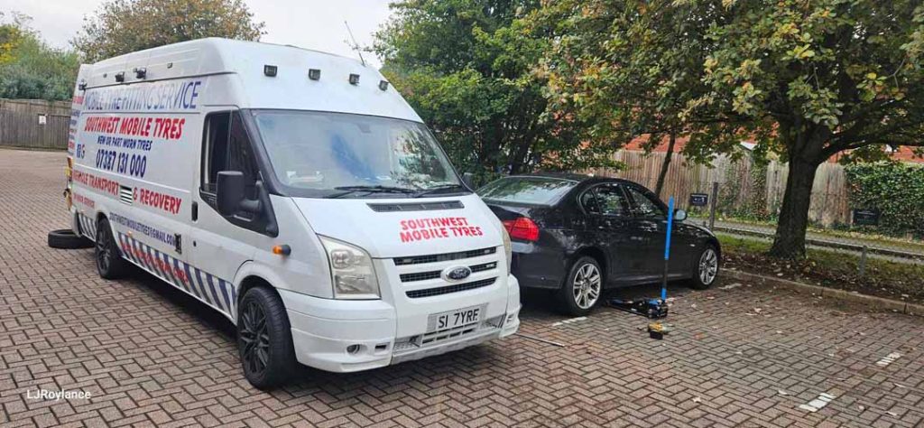 car tyre change in carpark